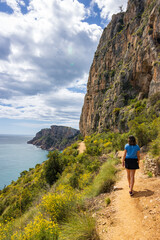 Naklejka premium Hiking trail in Benitachell cliffs, from Moraig beach to Llebeig beach in Alicante (Spain)