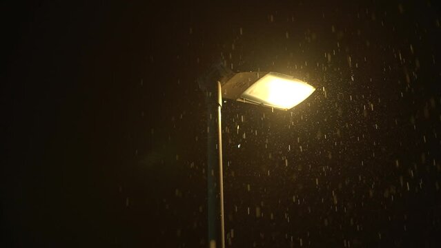 Night Street Lamp in Rainy Weather Ambient Stock Footage to Set an Atmospheric Scene