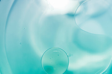 Oil drop background on blue water surface It is natural and abstract.