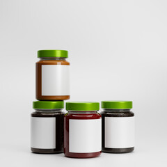 Set of different glass jam jars with blank label isolated over white background. Mockup template. 3d rendering.