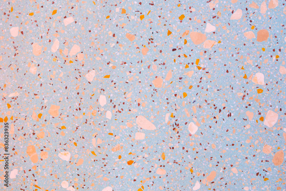 Poster A background with a lot of different colored rocks scattered all over it. The rocks are of various sizes and colors, creating a visually interesting and unique pattern