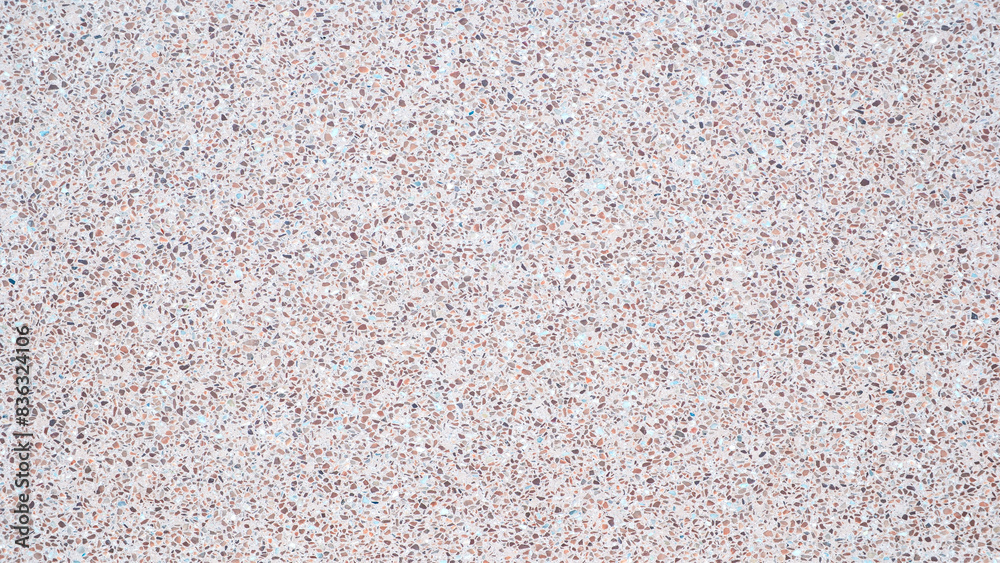 Poster A background with a lot of different colored rocks scattered all over it. The rocks are of various sizes and colors, creating a visually interesting and unique pattern