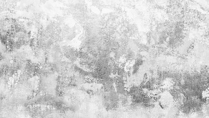 A grey wall with a few spots of color. The wall is covered in paint and has a rough texture