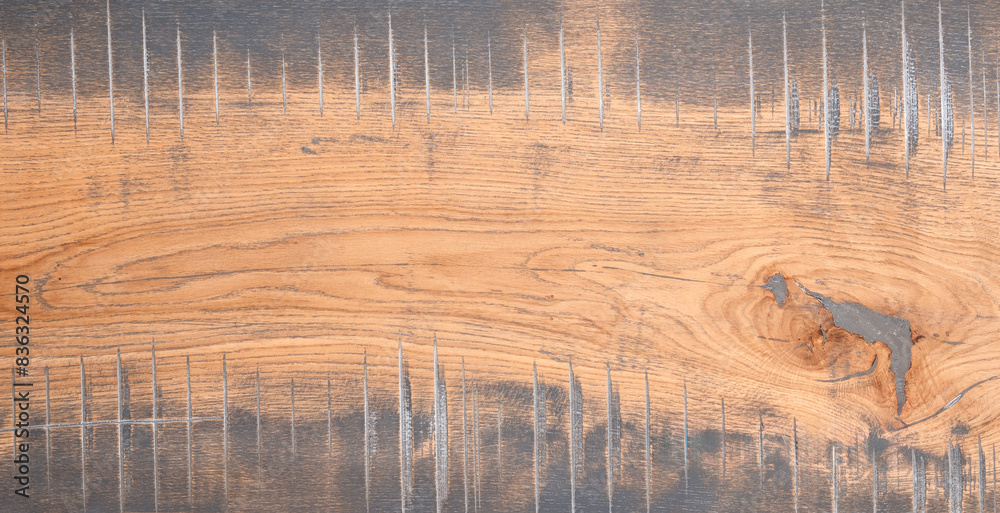 Aufkleber A wooden board with a grain pattern and a few holes. The board is brown and has a rustic feel