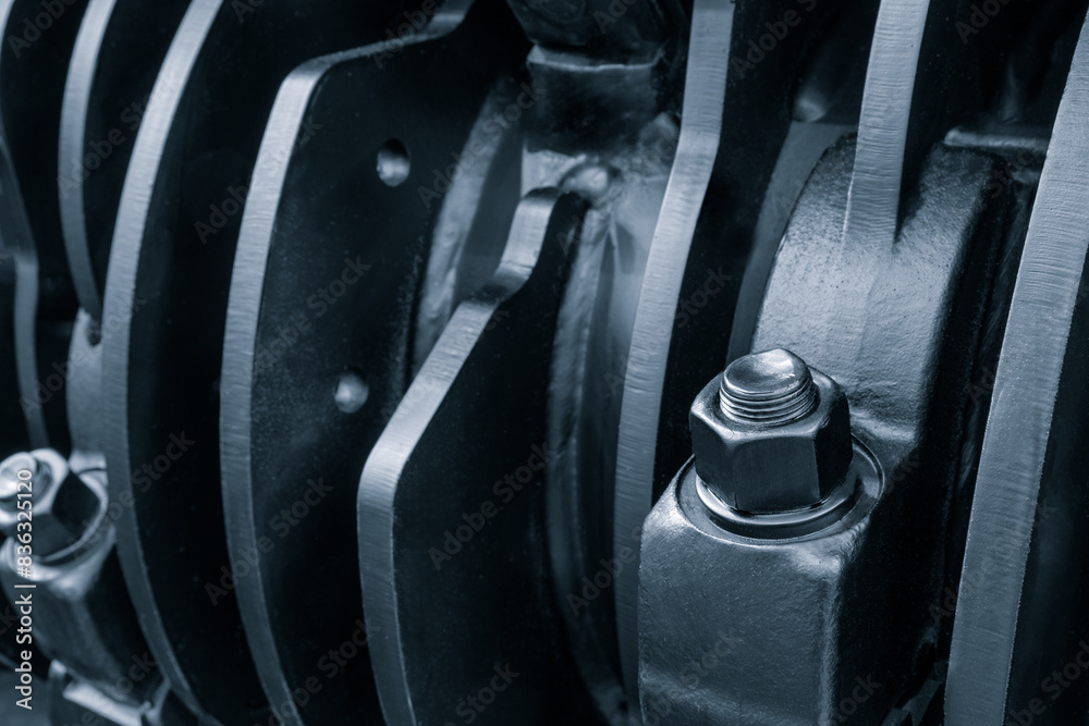 Poster A close up of a machine with a black and silver color scheme