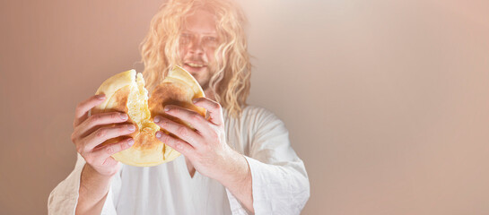 Jesus Christ breaking bread as a symbol of Communion