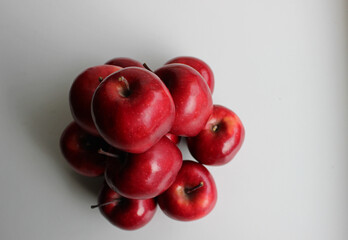  Juicy Red Apple Fruits Laid Out In Heap On Clean White Table Top View. Stock Photo For Fruits Diet And Nutrition Illustration  