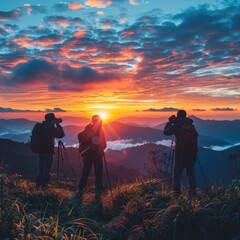 Fototapeta premium Photographers capturing sunrise over mountains, World Photography Day