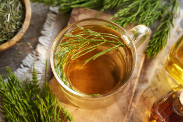 Horsetail tea in a glass cup