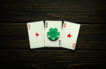 A very interesting and gambling game of poker with a successful winning combination of three of a...