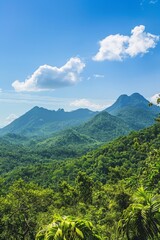 Tranquil Mountain Landscape with Lush Greenery and Clear Blue Sky Copyspace