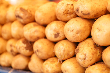 Young fresh potatoes on a bazaar counter