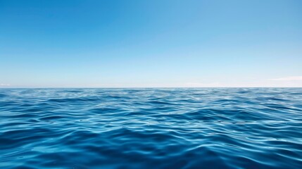 Obraz premium Tranquil Seascape with Clear Blue Sky, Serene Ocean Waves, and Copyspace for Relaxation and Mindfulness Concept.