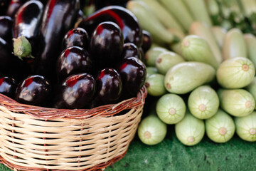  eggplants and zucchini on a bazaar counter