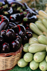  eggplants and zucchini on a bazaar counter