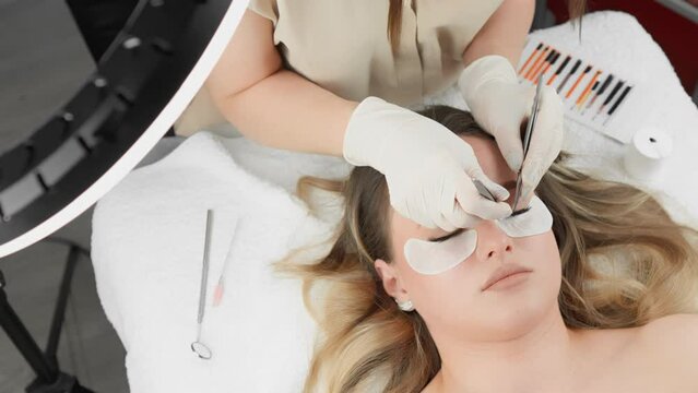 Experience luxurious eyelash extensions at a professional salon. A skilled beautician will meticulously apply extensions for a precise and glamorous look during your relaxing appointment