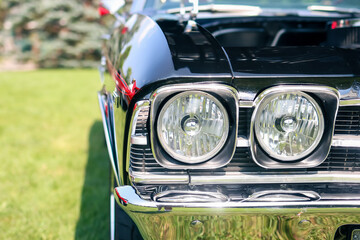 The Classic muscle car front right head lamps view.