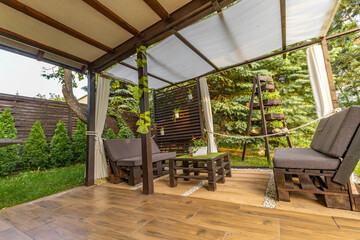 Fototapeta premium Garden terrace, resting place, flowers, wooden pergola
