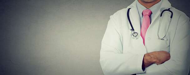 Cropped image of a doctor on wall background with copy space 