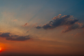 The sky is a beautiful shade of blue with a few clouds scattered throughout