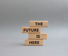 The future is here symbol. Concept words The future is here on wooden blocks. Beautiful grey...