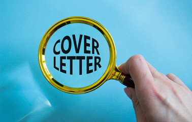 Cover Letter symbol. Concept word Cover Letter with Magnifying glass. Businessman hand. Beautiful...