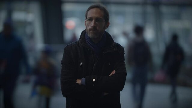 Portrait of Thoughtful Man Thinking Worried Looking at People Commuting