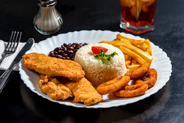 chicken nuggets with french fries and rice
