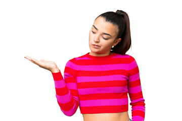 Fototapeta premium Young beauty woman over isolated chroma key background holding copyspace with doubts