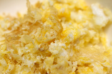 Scrambled eggs background. ready-to-eat eggs. Scrambled eggs covering the whole frame.