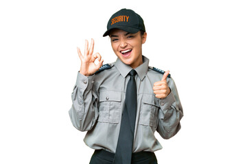Young safeguard woman over isolated chroma key background showing ok sign and thumb up gesture