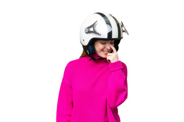 Young pretty woman with a motorcycle helmet over isolated chroma key background laughing