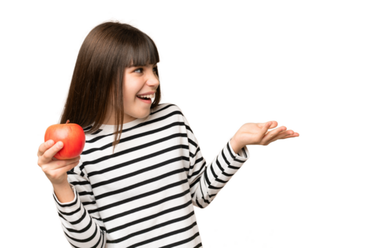 Little girl with an apple over isolated chroma key background with surprise facial expression