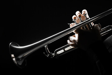 Trumpet player hands playing brass instrument. Jazz musician woman close up