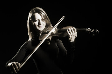 Violin player. Violinist woman classical musician playing concert