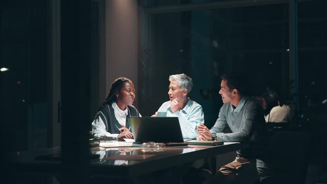 Business people, laptop and night meeting in office for overtime audit, erp and budget plan deadline. Corporate team, accountant and spotlight with tech for financial report, review and communication