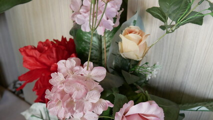 synthetic flowers that resemble real flowers for room decoration. Photo of a beautiful blooming flower plant taken in close-up and selected focus