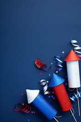 4th of July fireworks with decorations on dark blue background. Happy Independence Day concept.