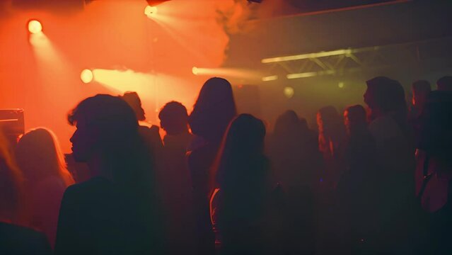 Underground music club. People partying and dancing in disco at night. Bloody disco party. Weird feel girl dance. Underground culture lifestyle. Young cool female moves with strange red luminescence. 
