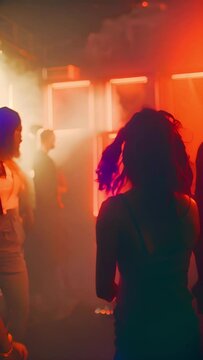 Underground music club. People partying and dancing in disco at night. Bloody disco party. Weird feel girl dance. Underground culture lifestyle. Young cool female moves with strange red luminescence. 
