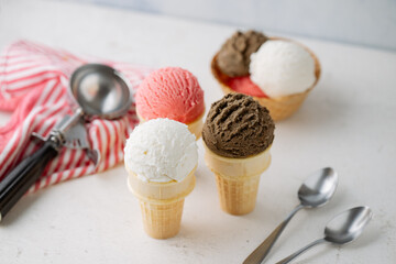 vanilla, chocolate, strawberry ice creams on cone