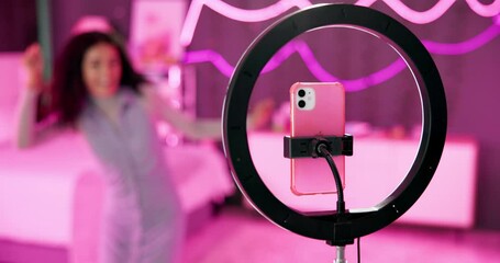 Girl, dancer and ring light with phone for live stream for social media, connection or audience for online. Female person, influencer and bedroom for video, content creation and tech at home for app - Powered by Adobe