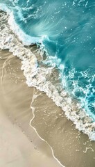 Sandy beach and soft blue ocean wave top view. Summer background