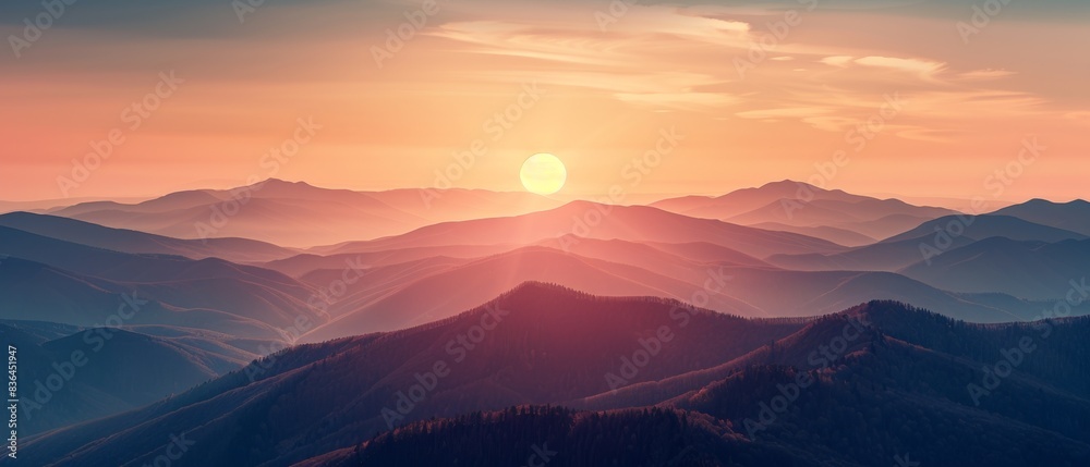 Wall mural breathtaking view of sunrise over misty mountains with colorful sky, creating a tranquil and serene 