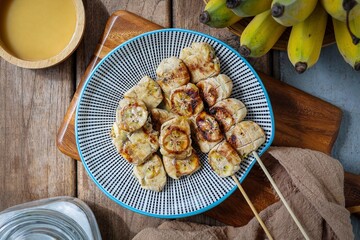 Grilled Banana with Coconut sauce, top view food table