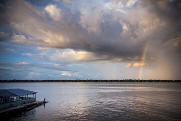 A beautiful rainbow at dusk on the Rio Negro, in the Anavilhanas river archipelago, in the Brazilian Amazon rainforest. The beauties of nature.