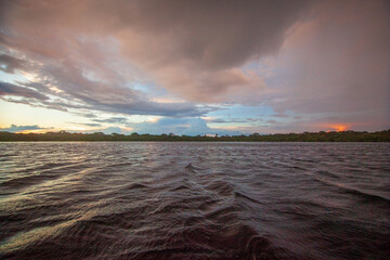 A beautiful rainbow at dusk on the Rio Negro, in the Anavilhanas river archipelago, in the Brazilian Amazon rainforest. The beauties of nature.