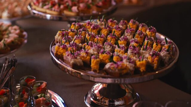 Gourmet appetizers on a platter at a luxurious buffet showcase culinary skills and dining experience