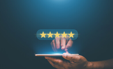 Reputation and quality Concept. Businessman using smartphone to give five-star symbol for highest...