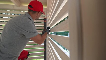 Installing Wooden Louvers on a Pergola